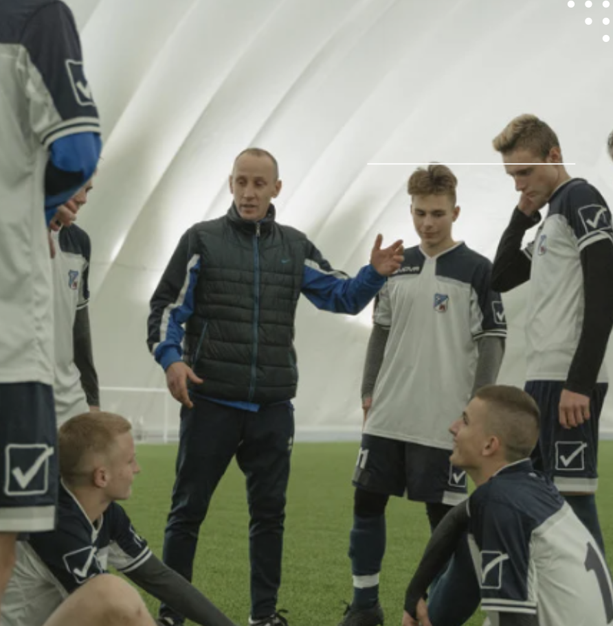 Coach talking to athletes