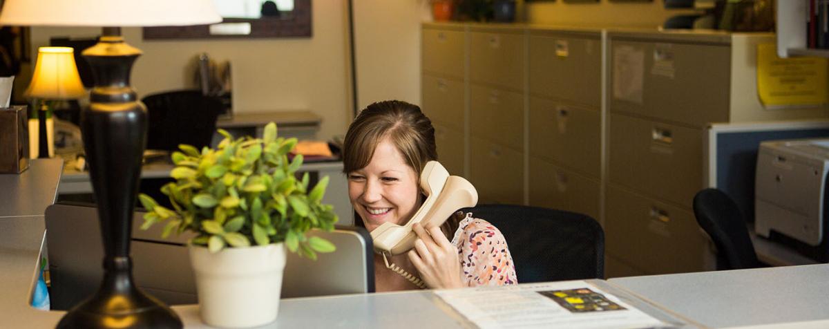 Office manager on phone